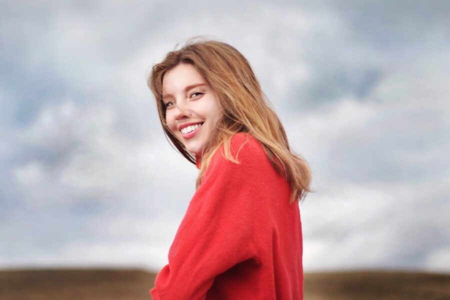 woman outside in red sweater