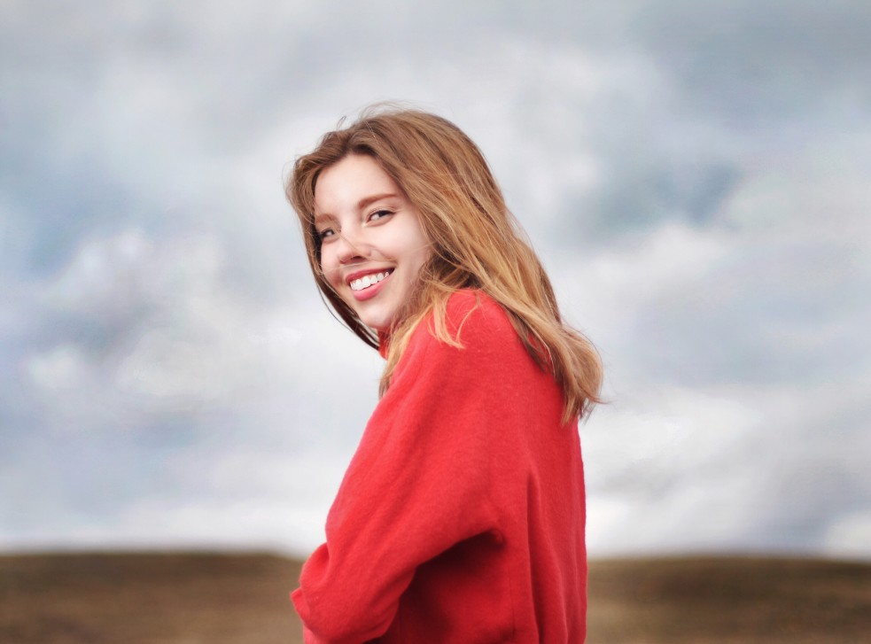 woman outside in red sweater