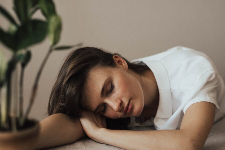 woman sleeping at table