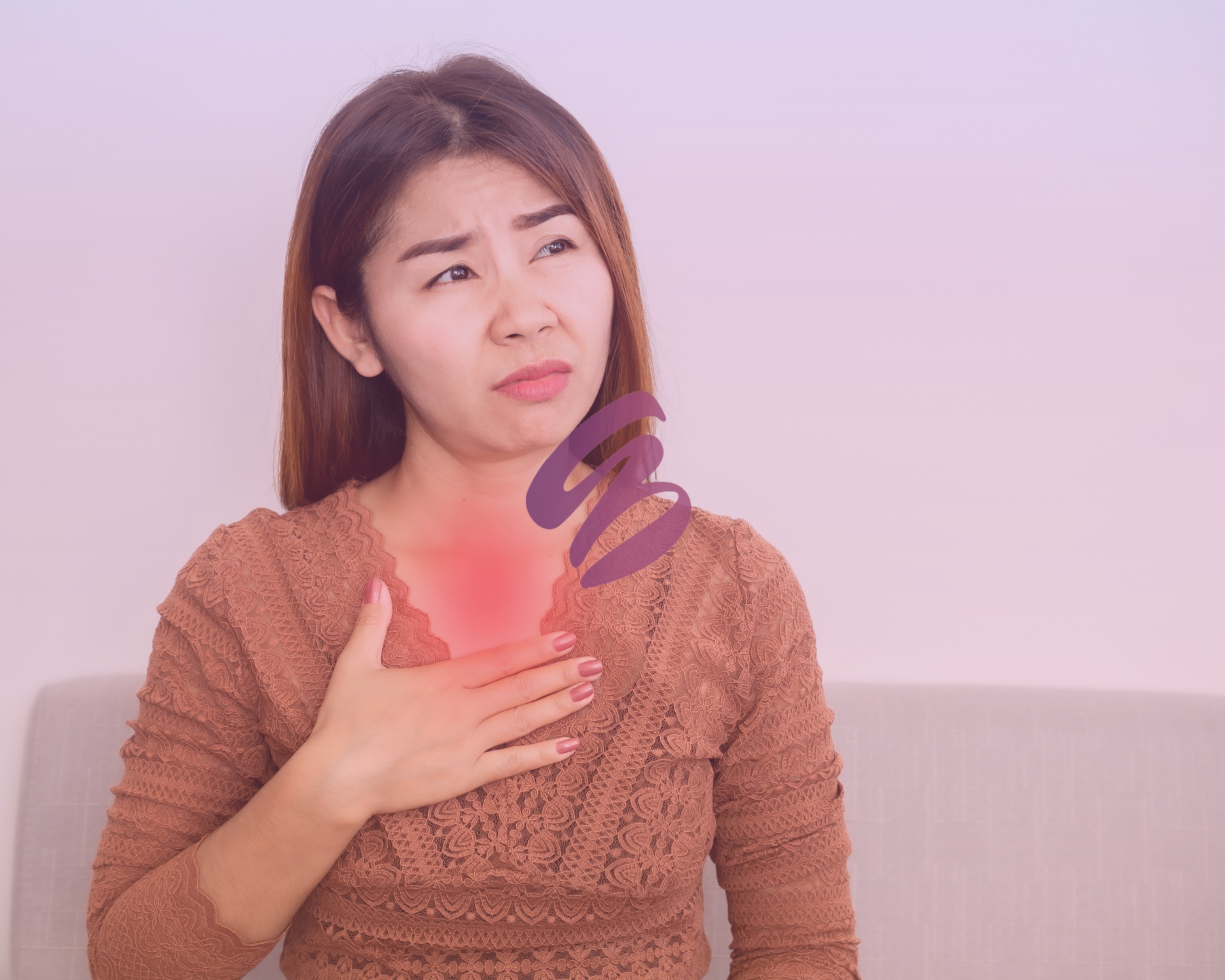 woman holding chest experiencing acid reflux