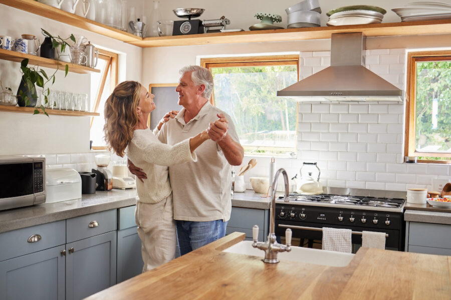 Couple dancing in the kitchen after HRT in Kenwood, OH.