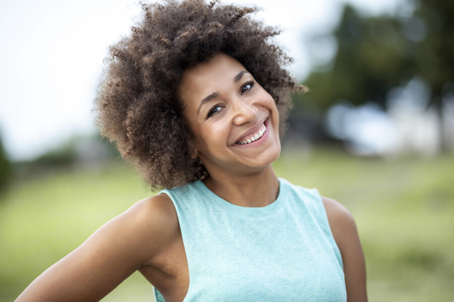 Smiling woman after receiving PCOS treatments in Cincinnati.