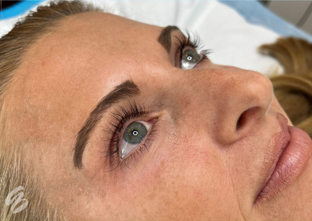 close up of woman's face after lash lift and tint