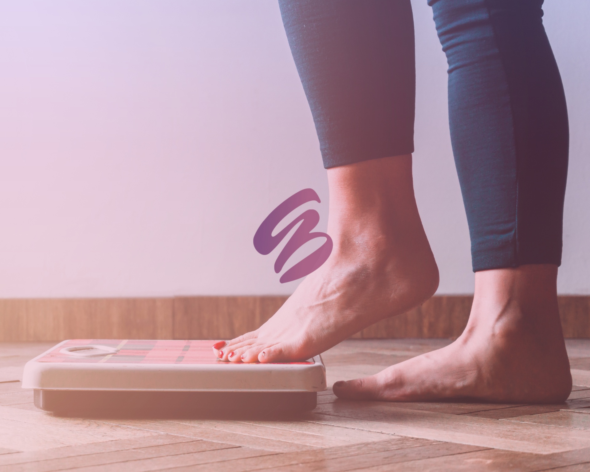 Close up of a woman's feet as she weighs herself after weight loss