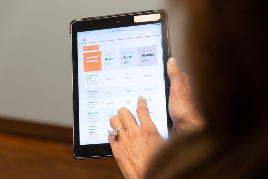 A tablet screen showing the different membership plans for a med spa in Hyde Park, OH