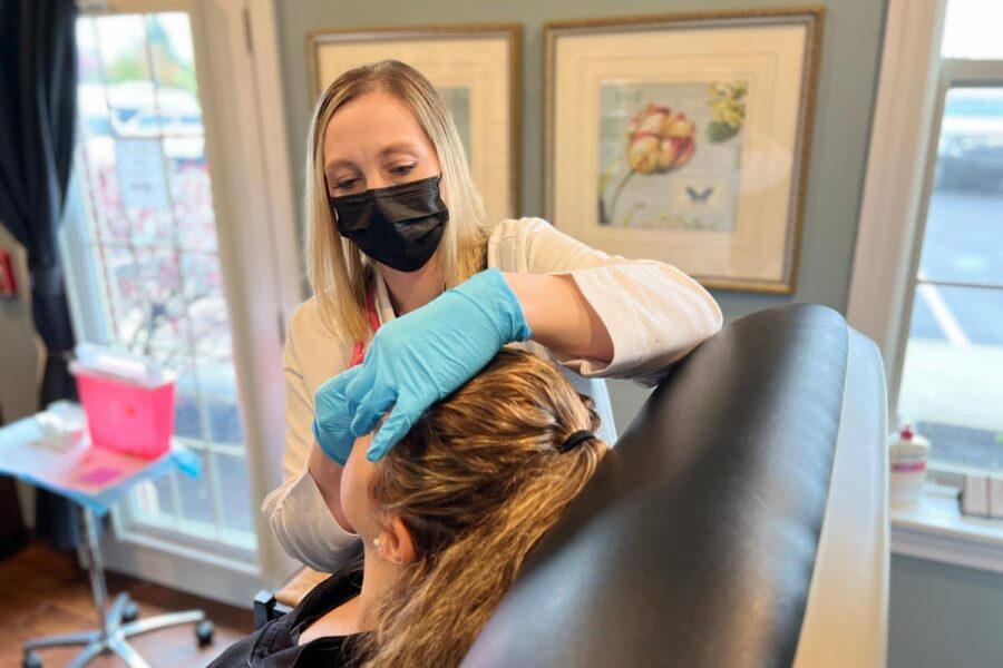 A woman performing Botox in Hyde Park, OH