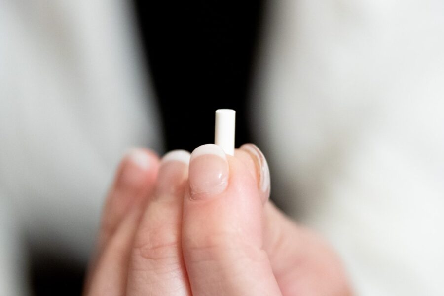 Close up of a pellet for treating a patient with hormone optimization in Cincinnati
