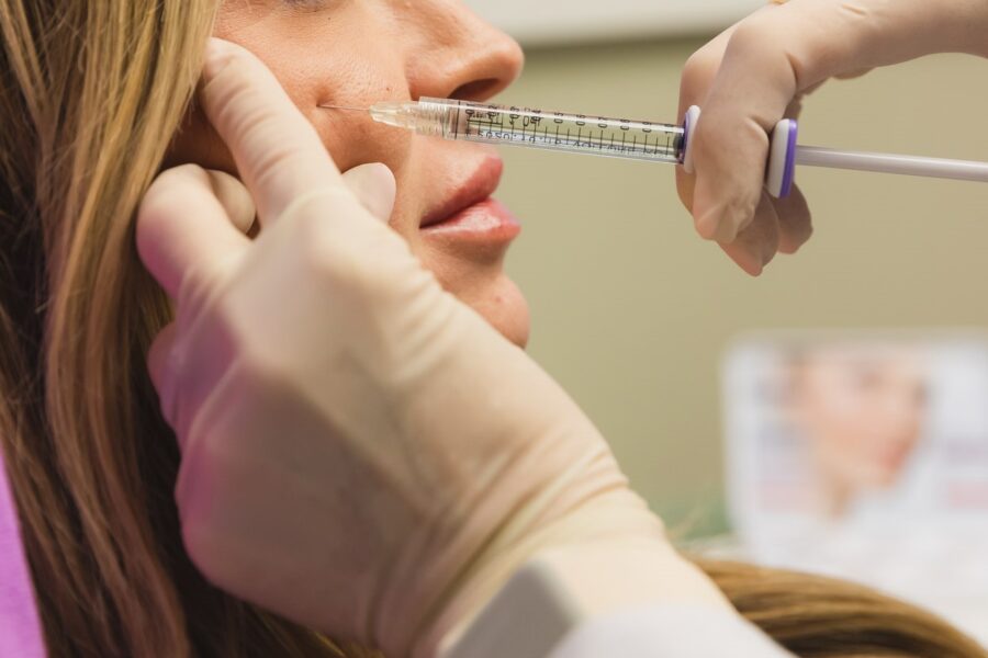 Close up of a woman receiving a cheek filler injection, one of our anti-aging injectables in Cincinnati.