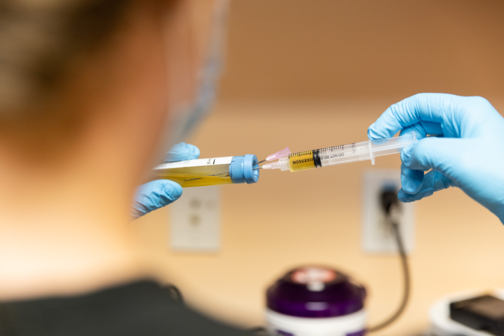 A provider prepares an O-shot for a patient as part of our approach to functional medicine in Mason.